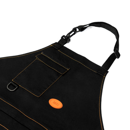 Contrast orange stitching on black organic canvas and orange MDS patch in PVC on Modular Apron